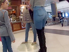 Perfect girl in tight jeans and high boots