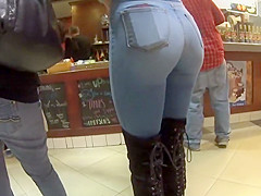 Perfect girl in tight jeans and high boots