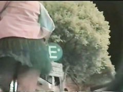 Perfect up skirt shot of black thong with help from the wind