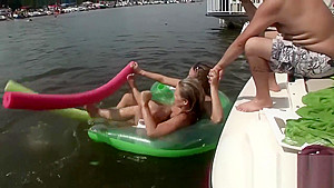 Raunchy babes have fun in the water
