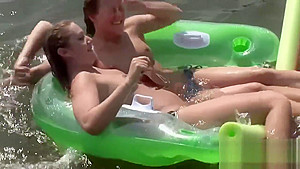 Raunchy babes have fun in the water