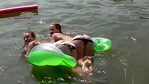 Raunchy babes have fun in the water
