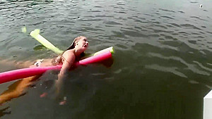 Raunchy babes have fun in the water
