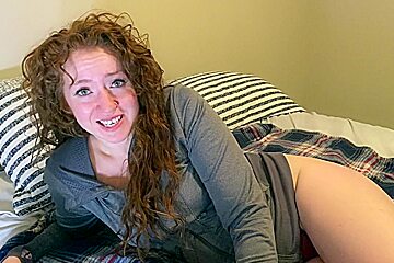 Redhead milf talks about getting fucked by two men as she rubs her pussy