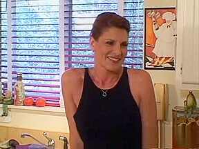 Seductive mature lady has wild sex with a younger guy in the kitchen
