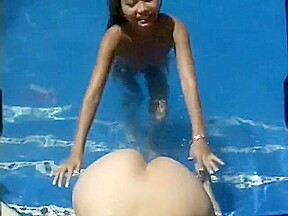 Sexy Asian babe and attractive brunette girl fulfill their lesbian needs by the pool