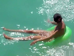 Sexy Naked Milfs Sunbathing Nude in the water
