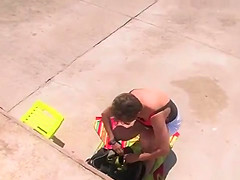 Shackled blonde in underwear in public