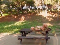 Shackled blonde in underwear in public