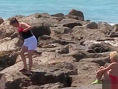 Shackled blonde in underwear in public