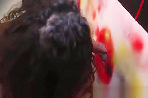 Shemale takes two dicks in a gloryhole