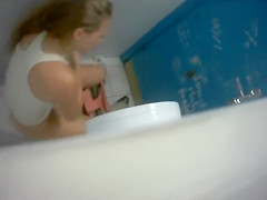 Skinny maids enjoy doing a number three in a public WC