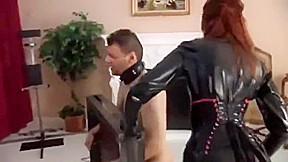 Slave gets caned by a redhead dominatrix