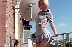 Stripping on Balcony in Public (not sure she has quite maste