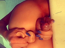 TS shows off her cock from the back