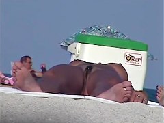 Tanned pierced marvelous babe getting recorded on the nudist beach