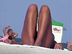Tanned pierced marvelous babe getting recorded on the nudist beach