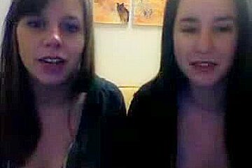 Tow horny wenches fooling around and flashing assets on live cam