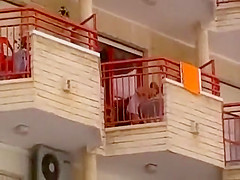 Upskirt of a neighbor at a balcony