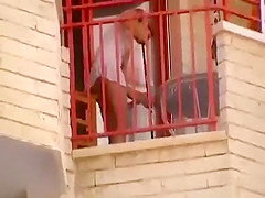 Upskirt of a neighbor at a balcony