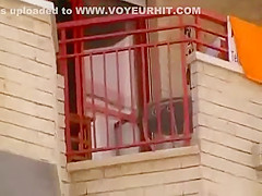 Upskirt of a neighbor at a balcony