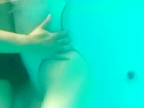White Asics swimsuit underwater play