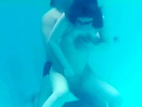 White Asics swimsuit underwater play