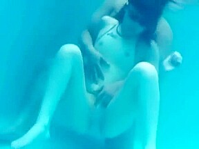 White Asics swimsuit underwater play