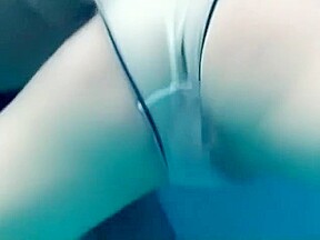 White Asics swimsuit underwater play