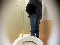 Woman spied in public toilet