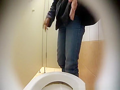 Woman spied in public toilet