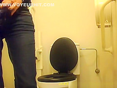 Woman squats over toilet to pee