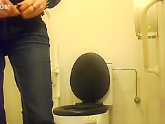 Woman squats over toilet to pee