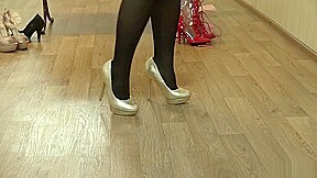 Young slender girl trying on shoes HD