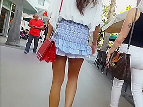 candid gorgeous model in blue ruffle skirt