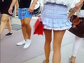 candid gorgeous model in blue ruffle skirt