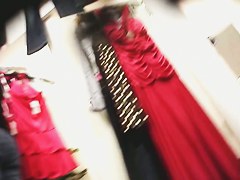 dressing room video with female trying on new dress
