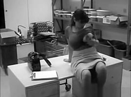 secretary with big tits masturbates in office